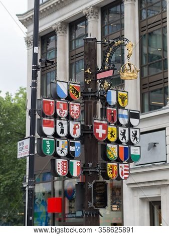 London, United Kingdom- June 2019: The Helvetic Cantons Insigna Showing The Coats Of Arms Of All The