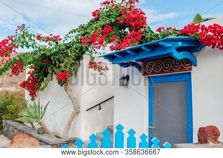Traditional Architecture In Akrotiri Village On Santorini Island Greece. White House Blue Doors Boug