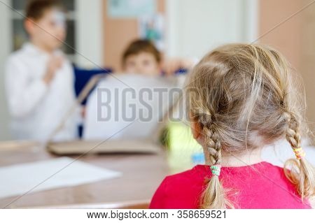 Two Little School Kids Boy Making Paper Doll Theatre For Little Sister. Happy Children Figures And P