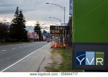 Richmond, Bc, Canada - Mar 29, 2020: An Electronic Road Sign At Yvr Airport Displaying Public Health