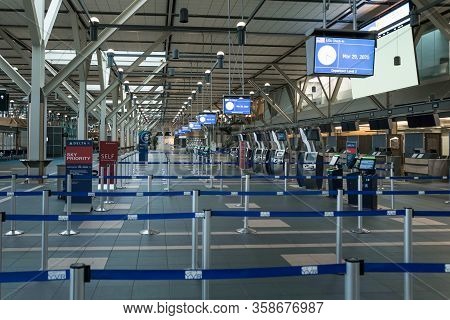 Richmond, Bc, Canada - Mar 29, 2020: International Departures Section Of Yvr Which Is Nearly Empty D