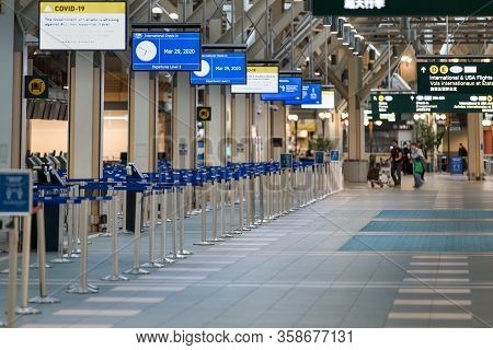 Richmond, Bc, Canada - Mar 29, 2020: International Departures Section Of Yvr Which Is Nearly Empty D