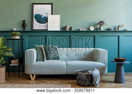 Stylish Interior Of Living Room With Mint Sofa, Design Furnitures And Elegant Interior Accessories. 