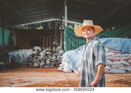 Farmer Agriculturist With Organic Fertilizer