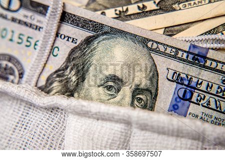 A Hundred-dollar Bill With A Medical Mask .the Concept Of Coronavrius Epidemic