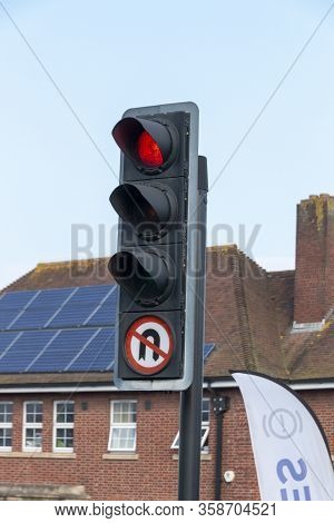 Bristol-march 2020-england- A Close Up View Of A Red Robot Or Traffic Light With A No Uturns Sign At