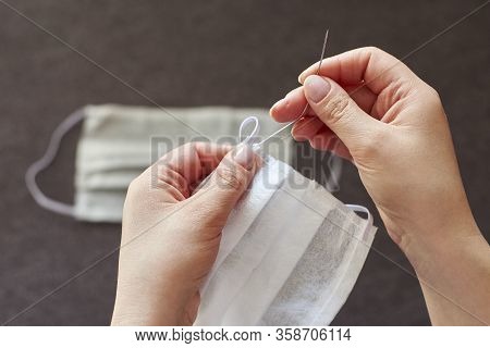 Hands Of A Woman Who Sews Medical Masks At Home.
