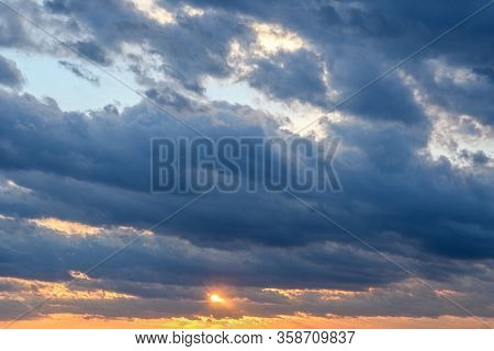 Stormy Sky With Storm Clouns On The Sunset With Beautiful Sun