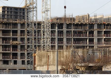 Tower Cranes Working On The Construction Of The Building