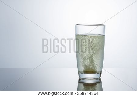 The Effervescent Tablet Dissolves In A Glass Of Water