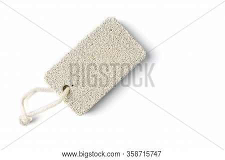 A Piece Of Pumice With A Rope In The Background