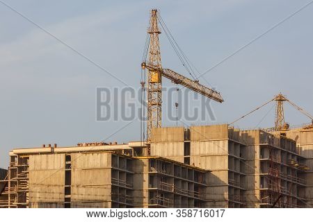 Tower Cranes Working On The Construction Of The Building