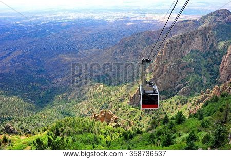 Sandia Tram Slowly Ascends From The Base Of The Sandia Mountains To The Crest. Vista Of Mountain And