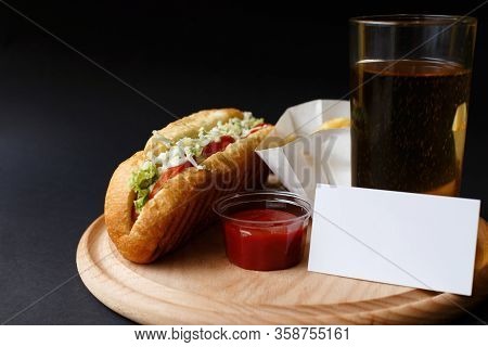 Hot Dogs With French Fries And Ketchup On Wooden Plate.