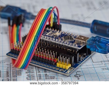 Arduino And Programmers With Peripherals And Expansion Boards Lie On A Gray Background. Do It Yourse