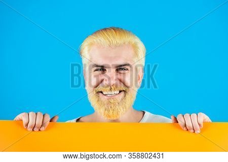 Area For Advertising. Advertising Banner. Man Holding Blank Paper Board Studio Portrait. Isolated Ma