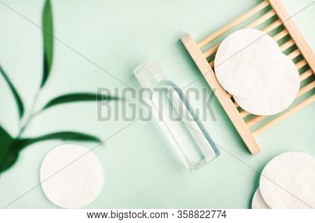 Cosmetic Product Plast Bottle Top View Blue Background Pastel Colors, Cotton Pads, Plant Leaf Decor,