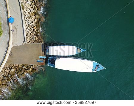 A Top View Of Two Boats In Acapulco Dock