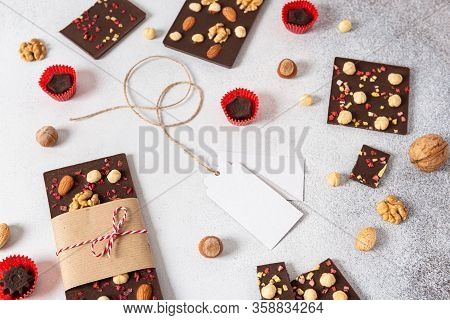 Milk Chocolate Bars With Nuts And Candies On Light Background. Homemade Organic Chocolate. Handmade 