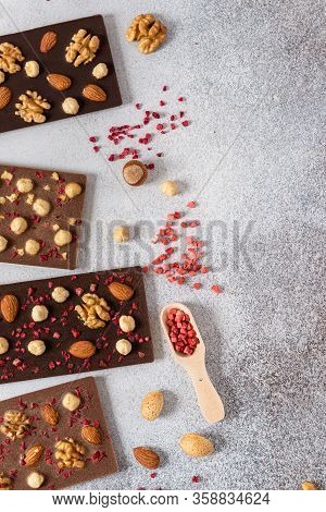 Variety Of Dark And Milk Chocolate Bars With Nuts And Dried Fruits. Handmade Organic Chocolate. Top 