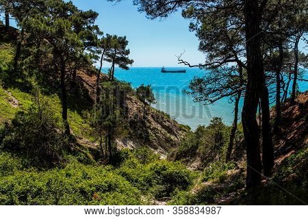 Hiking in picturesque places on the wild beach and camping. The outskirts of the resort of Gelendzhik and the neighboring city of Novorossiysk. Black sea coast