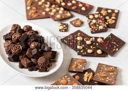 Variety Of Dark And Milk Chocolate Bars And Candies With Nuts And Dried Fruits. Handmade Organic Cho