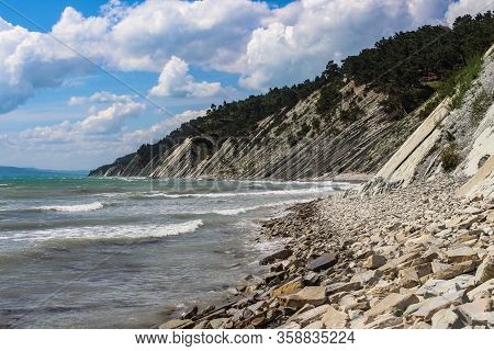 Blue abyss, a picturesque wild beach at the foot of the rocks in the vicinity of the resort of Gelendzhik. Black sea coast