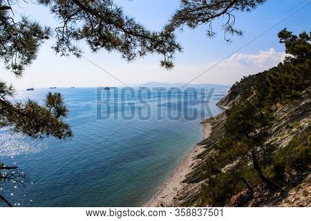 a trip to the wild beach and camping, the surroundings of the resort of Gelendzhik and a view of the rocks and cargo ships of the neighboring city of Novorossiysk. Black sea coast