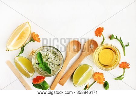 Homemade Skin Care Scrub With Fresh Herbs Of Mint, Calendula, Lime Slices, Olive Oil, Sea Salt. Natu