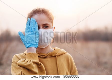 Covid-19 Pandemic Coronavirus Girl In Mask And Blue Gloves During Quarantine