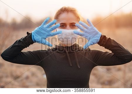 Covid-19 Pandemic Coronavirus Girl In Mask And Blue Gloves During Quarantine