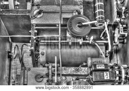 Inside View Of High Frequency Power Amplifier With Capacitors, Coils And Other Components In Black A