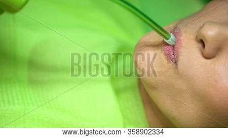 Dentist Removing Saliva With Ejector, Hygienic Procedure With Modern Equipment