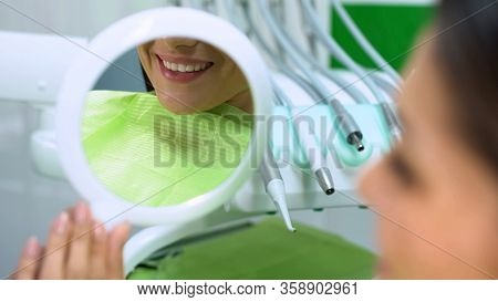 Snow-white Smile Reflected In Mirror After Sealant Placement Aesthetic Dentistry