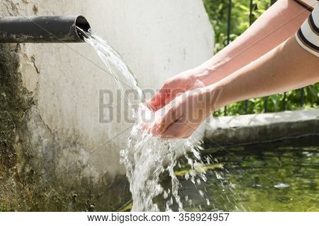 Free Water Fountain For People Usage Into The Wild. Water Taps Are Too Old, Most Probably From Eight