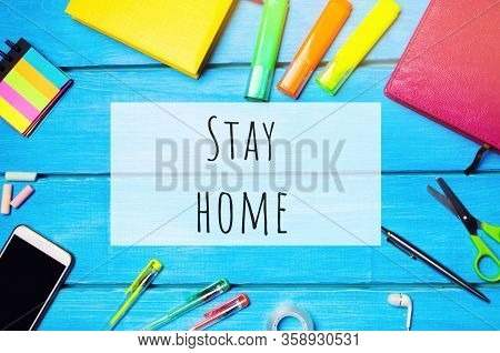 School Desk With The Words Stay Home. The Concept Of Prevention From Coronavirus Infection. Self-iso