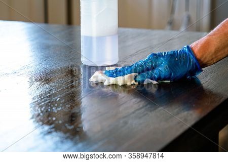 Wiping Down Surfaces And Disinfecting Table During Covid-19 Pandemic