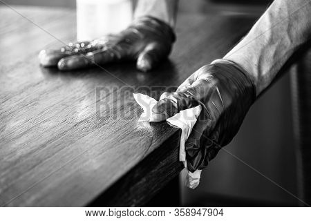 Wearing Gloves And Protective Gear Against Virus , Wiping Down Surfaces And Cleaning During Covid-19
