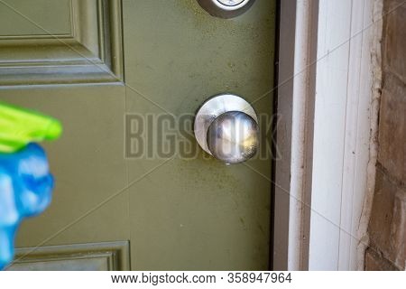 Front Door Cleaning Doorknob Hand With Blue Protective Glove Cleaning Barstool Wiping Down Surfaces 