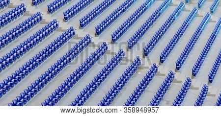 Empty Dark-blue Seats At The Stadium Before The Match.