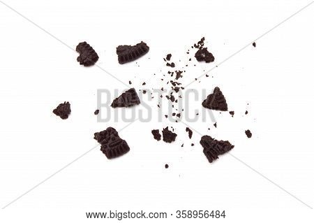 Oreo Biscuits With Crumbs  Isolated On White Background. It Is A Sandwich Cookies Filled With Chocol