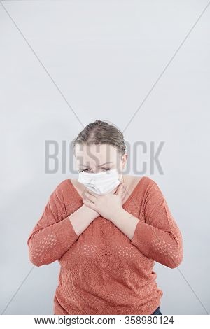 Covid-19 Pandemic Coronavirus. Close Up Of Middle Age Woman With Surgical Mask On Face Against Sars-
