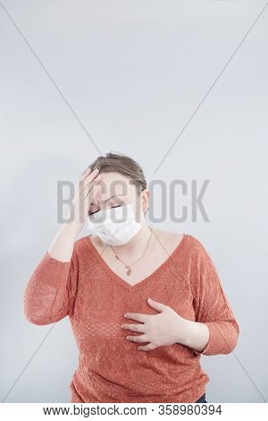Covid-19 Pandemic Coronavirus. Close Up Of Middle Age Woman With Surgical Mask On Face Against Sars-