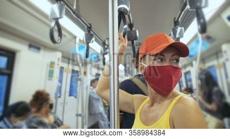 Woman Travel Caucasian Ride At Overground Train Airtrain With Wearing Protective Medical Mask. Girl 