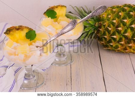 Pineapple Ice Cream In A Glass Bowl On A White Background.