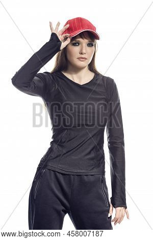 Sportive Caucasian Female Baseball Player Athlete Posing In Sportive Outfit Wearing Red Cap And Touc