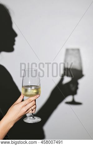 Abstract Woman Shadow And  White Wine Glass