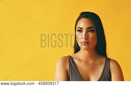 Headshot Beauty Shot Of Hispanic Latina Woman Thoughtful Young Adult With Black Long Hair And Tank T