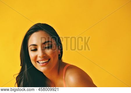 Headshot Beauty Shot Of Hispanic Latina Woman Toothy Smile Young Adult With Black Long Hair And Tank