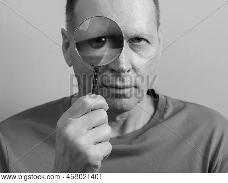 Person Looking Through Magnifying Lens Glasswith Curiosity, .